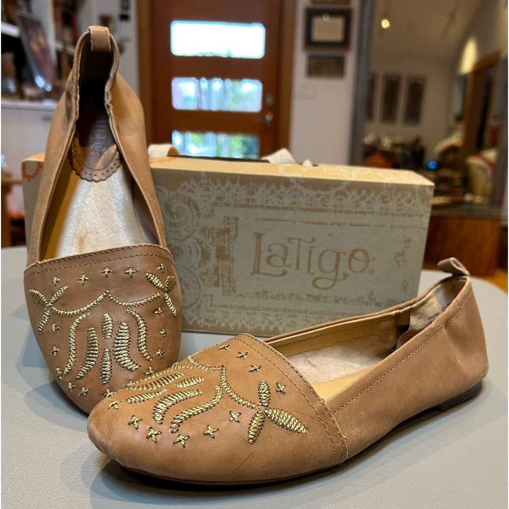 Leather camel flats with gold embroidery.